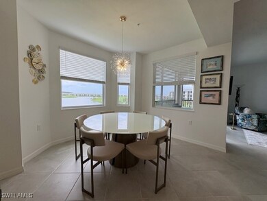 - Dining area with 6 chairs and chandelier overlooking Lake