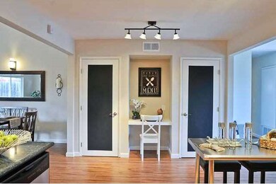 Double pantry closets accented with chalkboard pai