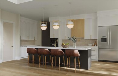 Kitchen featuring built in fridge, a kitchen island with sink, backsplash, and light wood-type flooring