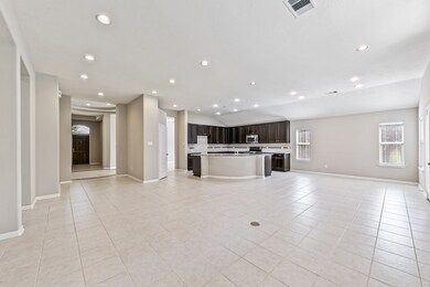 The kitchen opens up to the living area and breakfast area.