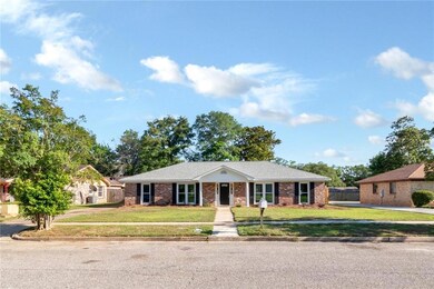 Single story home featuring brick siding