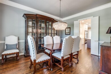 Dining room with dark hardwood / wood-style floors