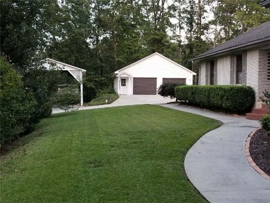 Attached carport; plus 2-Car Detached Garage with