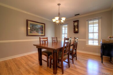 Formal dining room with crown & chair rail molding