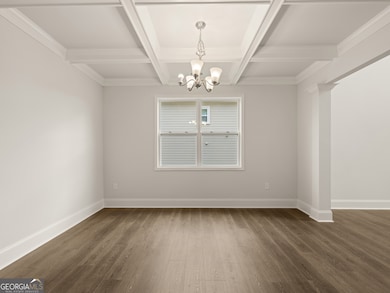 grayson dining room with coffered ceilings and a c