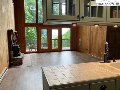 View from kitchen bar area thru great room to outs