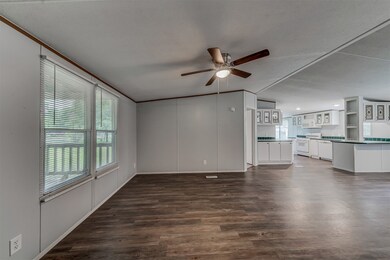 Here's another view of the living space in this 1,344 sq ft home.  Notice the kitchen is centrally located for all to enjoy.