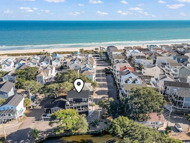 Aerial perspective of suburban area featuring waterfront with a beach
