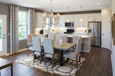 Another view of the kitchen and cafe,as shown in our former model in Lakeville