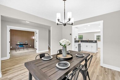 Dining area with a chandelier and light wood-type flooring