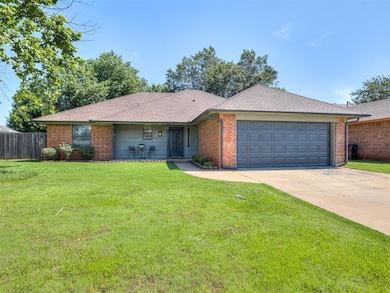 Ranch-style home with an attached garage, concrete driveway, brick siding, and roof with shingles