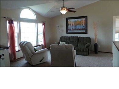 Natural light brightens this living room with vaul