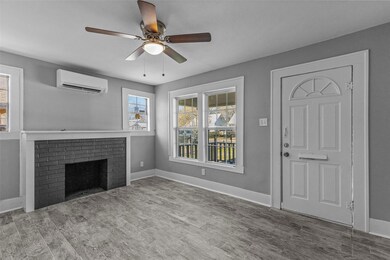 Unfurnished living room featuring ceiling fan, lig