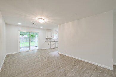 The dining room awaits you and your guests. Recessed lighting in the dining room and living room are such nice upgrades!