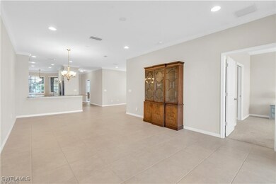 Empty room with recessed lighting, light tile patterned flooring, a chandelier, and ornamental molding