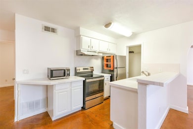 Kitchen with visible vents, stainless steel appli