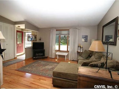 Living Room. Gorgeous hardwood floors, cathedral c