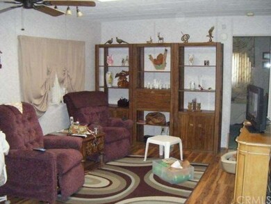 Family room has new laminate wood flooring, ceiling fan, and computer niche (not shown).