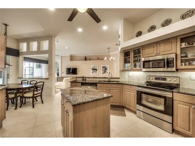 Spacious gourmet kitchen features a center island 