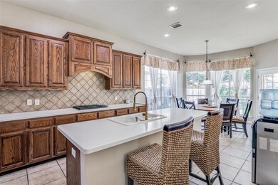 Large kitchen with island and breakfast nook area.