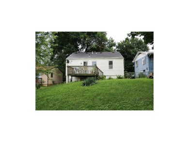 Relax on the deck and enjoy this backyard! Door to