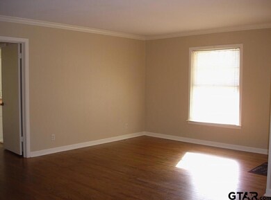 Living Room is spacious and has beautiful hardwood floors.
