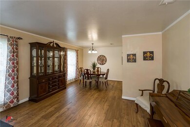 Large living/dining room with new wood floors.