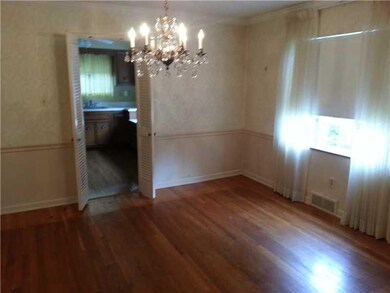 Dining Room. THE FORMAL DINING ROOM SHOWS THE CROWN MOLDING AND CHAIR RAIL THAT RUNS THROUGHOUT THE FIRST FLOOR.