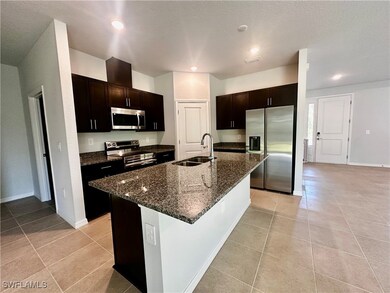 Kitchen with stainless steel appliances, an island