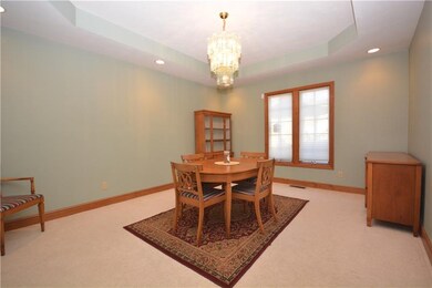 Dining room is right off of kitchen with tray ceil