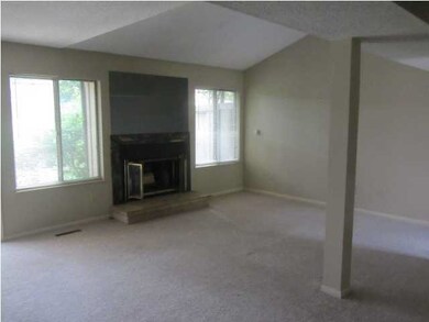 Open floor plan with cozy fireplace in the living 