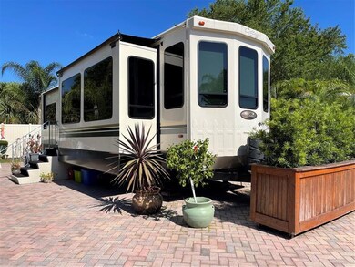 Wood planter on wheels can be rolled to the side.