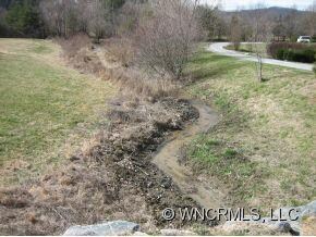 small stream along lot border