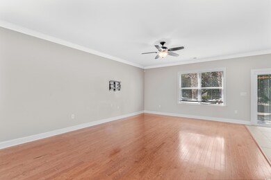 Unfurnished room with crown molding, ceiling fan, 