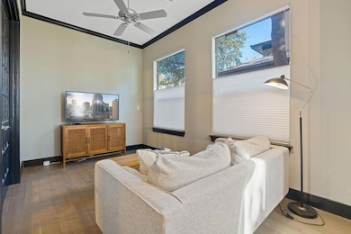 Living area with baseboards, ornamental molding, 