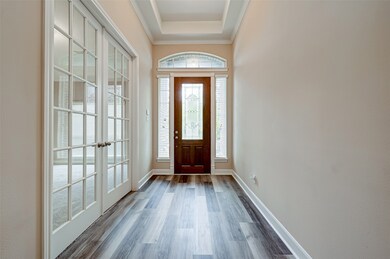 On-trend newly-installed luxury LVP flooring throughout the main living areas and dining room