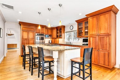 view of spacious island with seating for 3-4 peopl