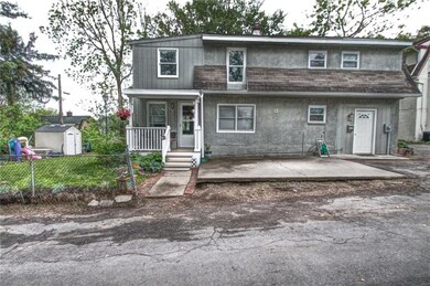 Enjoy a corner lot, newer front porch, partially f