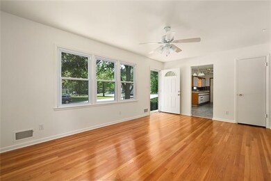 Lovely Natural Light fills the Living Room. Freshl
