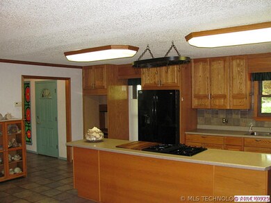 View from kitchen eating area toward front foyer.