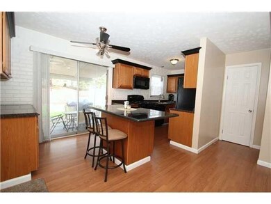 Sliding glass door to patio and fully fenced rear 