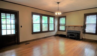 Living Rm entry & windows & fireplace p1