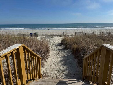 Property view of water featuring a beach view