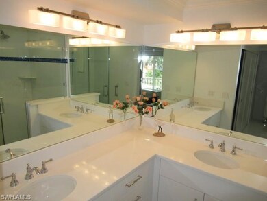 Corner Vanity and Mirrors with Double Sinks