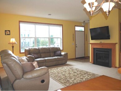 sun filled family room with gas FP and built-ins.