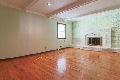 Family Room pegged wood floor and gas start fireplace