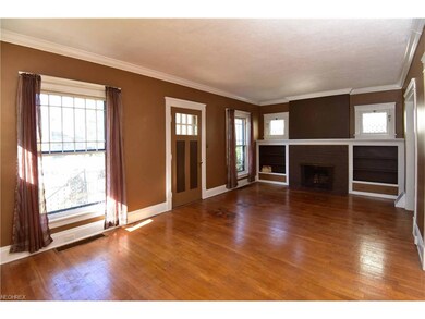 21 x 12 Living Room with WBFP flanked by built in shelves and a limited collection of floor to ceiling and petite windows with inlays . ..