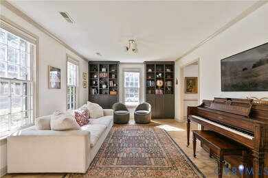 A cozy living room with charming crown molding