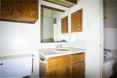 Bathroom featuring vanity, shower / tub combinatio