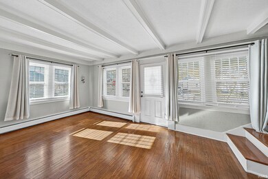 Living Room with beam ceiling